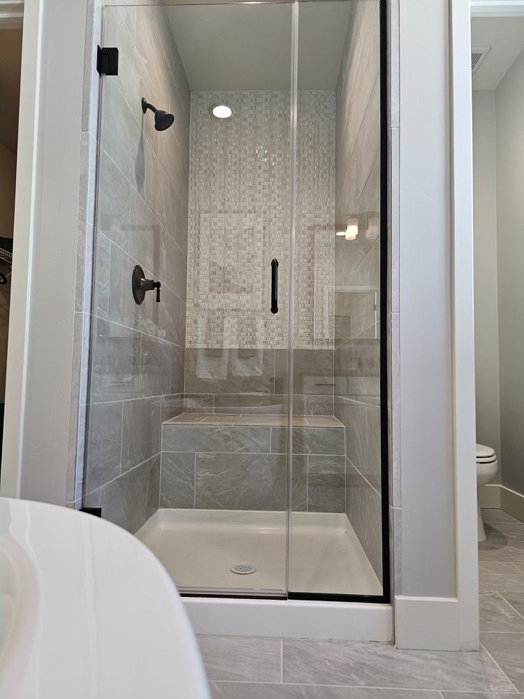 Curtis Ballard's finished tile shower with gray marble-look tile