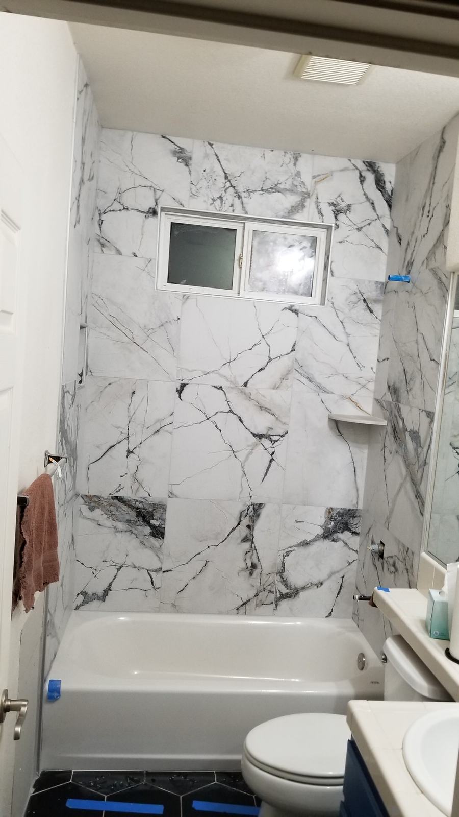 Large-format marble-look tile tub surround